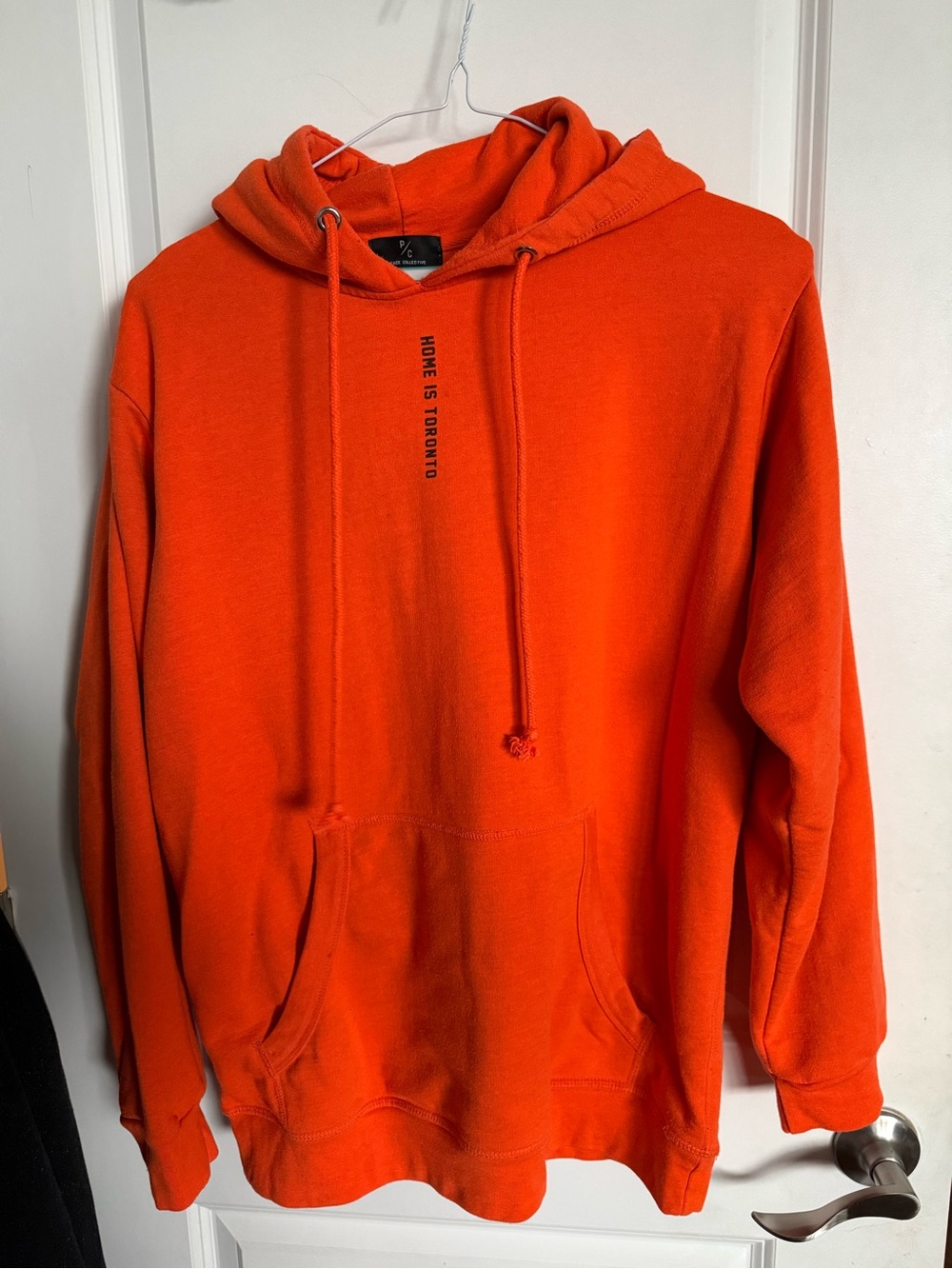Men's Orange Pullover Hoodie with Subtle Chest Text